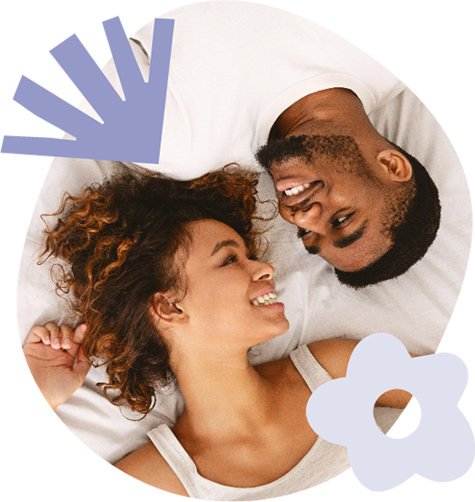 Happy couple laying down looking at one another