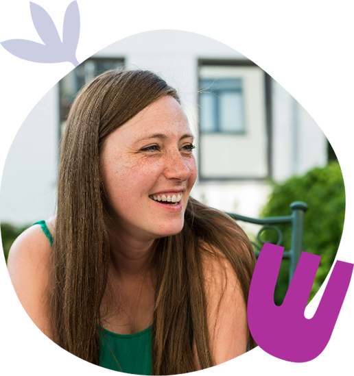 Young woman smiling on an outside chair